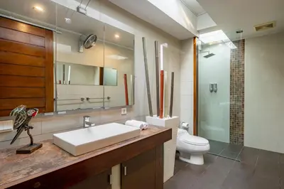 a bathroom with a sink and a toilet at Villa 500m2 with 14m Pool, BBQ, Pinball - Seminyak in Seminyak
