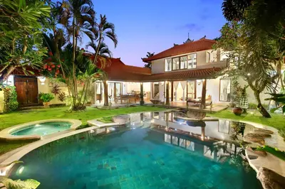 an image of a swimming pool in front of a house at Lepa Villa, Oasis in Legian in Seminyak
