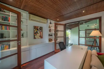 a living room with a couch and a table at Villa Claudia - Chic 3BR Family Villa with Pool & Play near Seminyak in Kerobokan