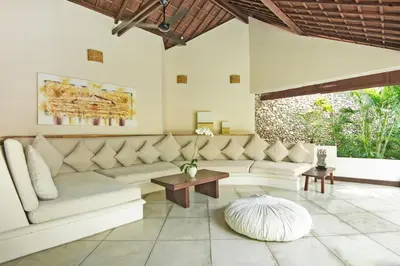 a living room with a couch and a table at Villa Kubu Seminyak in Seminyak