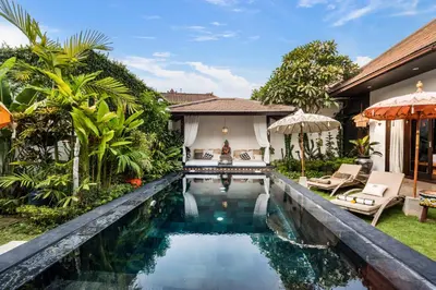 a swimming pool in the backyard of a villa at Villa Jami by BaliSuperHost in Seminyak