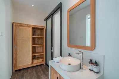 a bathroom with a sink and a mirror at Villa Selikur 2 - Brand New! Spacious 3BR Villa in Seminyak in Seminyak