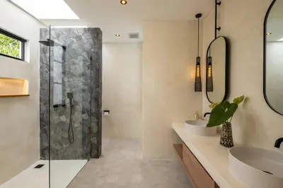 a bathroom with a shower and a sink at Villa Solaris Umalas by Santi Management in Kerobokan