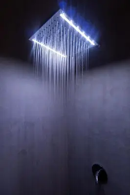 a shower with a bunch of lights in the rain at Villa KALOOKA, a vacation in paradise. in Seminyak
