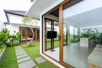 an external view of a house with sliding glass doors at J4 Villas Sanur in Sanur