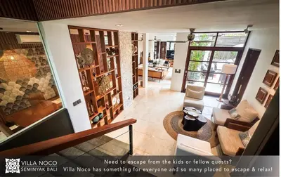 a view of a living room from the loft of a house at Noco Luxury Villa Seminyak in Seminyak
