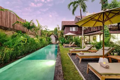 a pool in the backyard of a villa at Nativ Living Villa Legian 6BR Villa 16px Big Group Walk to 66 Beach in Seminyak