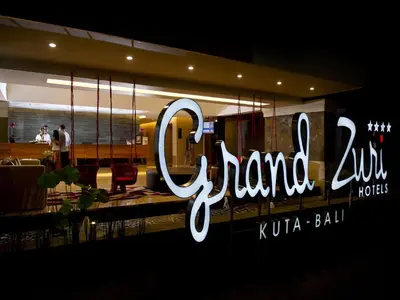 a sign on the side of a restaurant at Grand Zuri Kuta Bali in Kuta
