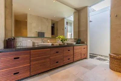 a bathroom with two sinks and a large mirror at Eshara 1 our Tropical & luxury 3BR Villa 450m from beach in Seminyak