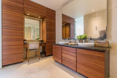 a bathroom with two sinks and a counter with a mirror at Eshara 3 our Peaceful 3BR Pool Villa close to Oberoi Beach in Seminyak