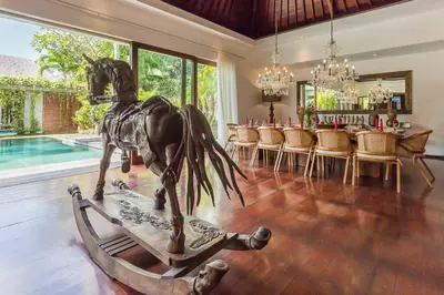 a statue of a horse on a treadmill in a living room at Eshara 21 our Luxury 5BR Villa Escape and huge pool Oberoi Beach in Seminyak