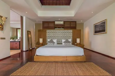 a bedroom with a large bed in a room at Eshara 21 our Luxury 5BR Villa Escape and huge pool Oberoi Beach in Seminyak