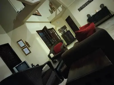 an overhead view of a living room with two chairs at Villa Layang Bulan a homey guesthouse for men near the beach in North Kuta in Denpasar