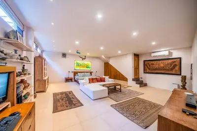 a living room with a couch and a tv at Jado 1 Unique Cinema Entertainment Villa in Umalas in Kerobokan