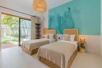 a bedroom with two beds and a large window at Villa Kiara our Paradise in Seminyak 5 bedrooms 12m private pool in Seminyak