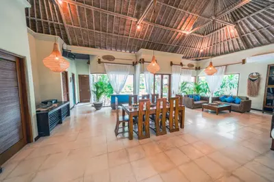 a living room with a table and chairs and a couch at Villa CHANDI 2 - Legian - Seminyak - 5 Bedroom 4 Bathroom Villa - Great Location ! in Seminyak