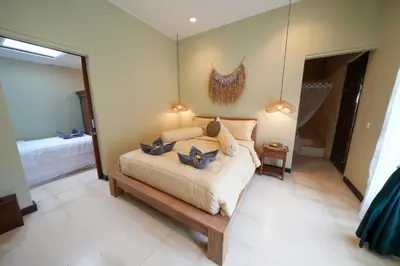 a bedroom with a bed and a mirror at Villa CHANDI 2 - Legian - Seminyak - 5 Bedroom 4 Bathroom Villa - Great Location ! in Seminyak