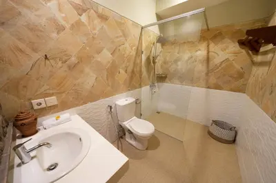 a bathroom with a sink and a toilet at Villa CHANDI 1 - Legian-Seminyak - 8 Bedroom - 7 Bathroom Villa in Seminyak