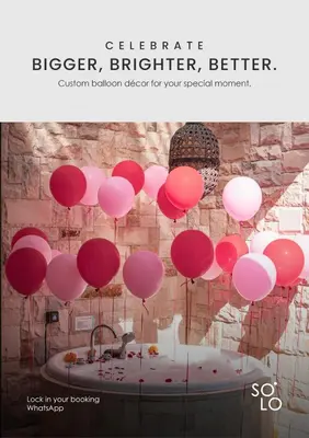 a bunch of pink balloons hanging from a ceiling at Kolila Villa Seminyak by Ini Vie Hospitality in Seminyak