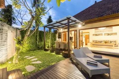 a garden with a patio and a house at Luxurious Double King Villa w/Pool & WiFi+ Carpark in Seminyak