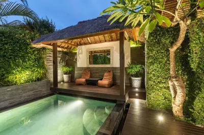 a backyard with a swimming pool and a gazebo at Luxurious Double King Villa w/Pool & WiFi+ Carpark in Seminyak