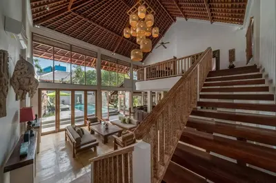 an open lobby with stairs and a chandelier at Balinese Luxury Amisha Villa: 4BR in Seminyak in Seminyak