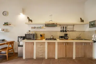 a kitchen with a sink and a counter with a microwave at 2 Br Villa in Seminyak with private Pool and Parking in Seminyak