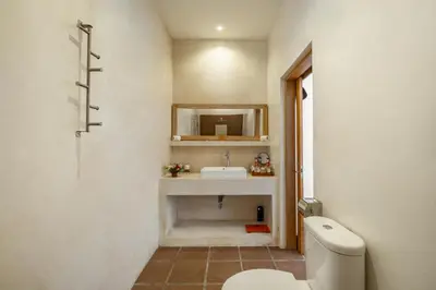 a bathroom with a sink and a toilet at 2 Br Villa in Seminyak with private Pool and Parking in Seminyak