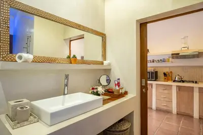 a bathroom with a sink and a mirror at 2 Br Villa in Seminyak with private Pool and Parking in Seminyak