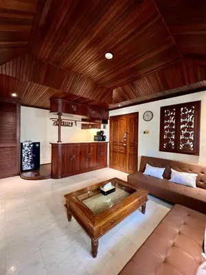 a living room with a couch and a coffee table at Galayanee’s Resort Apartment in Seminyak