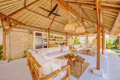 an outdoor living room with a large white couch and chairs at Villa Miami - New Luxury 7BDR Prime Location in Seminyak