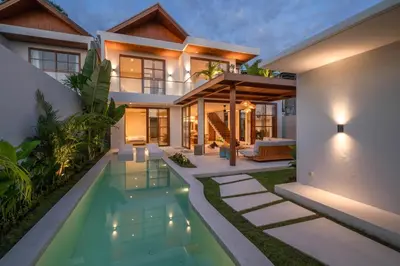an exterior view of a house with a swimming pool at Villa LouLou Bali - Brand New Tropical 3BR Villa Next to Canggu in Canggu