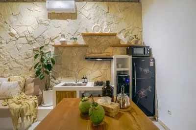 a kitchen with a wooden table with pears on it at Villa Aarka - Chic Balinese Bohemian Retreat in Seminyak in Seminyak