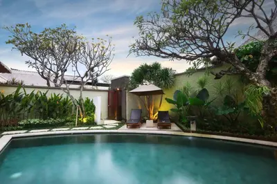a swimming pool in the backyard of a house at The Bali Bliss Villa in Seminyak