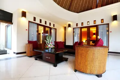 a lobby with couches and chairs and a table at The Bali Bliss Villa in Seminyak