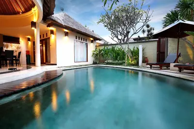 a swimming pool in the backyard of a house at The Bali Bliss Villa in Seminyak
