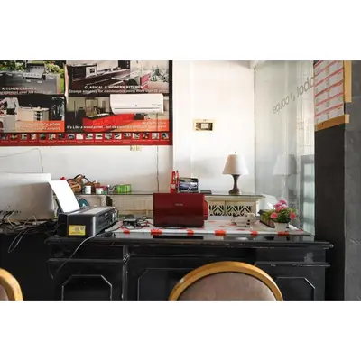 an office with a desk with a computer on it at Bunk Bed Bali near Sanur Mitra RedDoorz in Pesanggaran