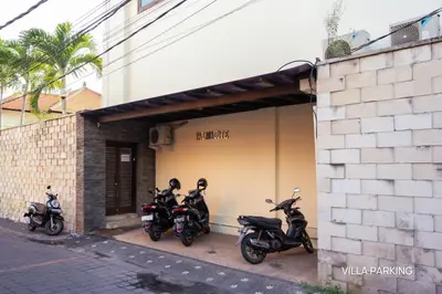 a group of motorcycles parked next to a building at Villa Palm Suites Bali in Seminyak