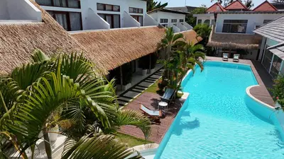 an overhead view of a swimming pool at a hotel at Berawa Village Apartment by Betterplace in Canggu