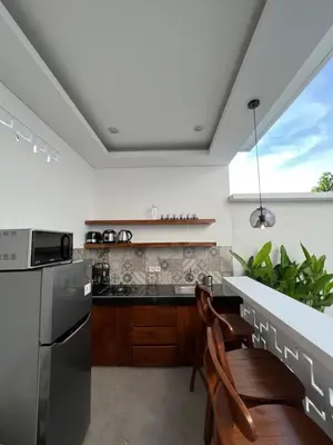 a kitchen with a sink and a stove top oven at Villa Carik by Globalstay - Kerobokan x Seminyak x Canggu in Kerobokan