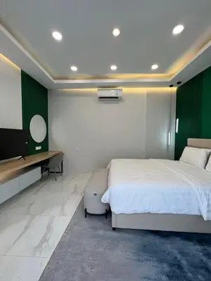 a bedroom with a bed and a flat screen tv at Villa Carik by Globalstay - Kerobokan x Seminyak x Canggu in Kerobokan