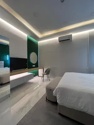 a bedroom with a bed and a desk and a chair at Villa Carik by Globalstay - Kerobokan x Seminyak x Canggu in Kerobokan