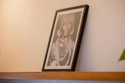 a framed picture of a woman on a shelf at Casa Moana Seminyak 3BR Stylish Private Pool Villa in Seminyak