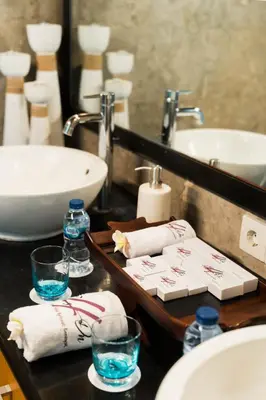 a bathroom with a sink and a counter with towels at Focus on 4 in Seminyak