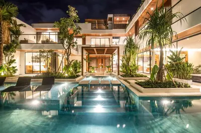 an indoor pool in a house with plants at Brand new Luxury 5 br villa 200m to Brawah Beach in Canggu