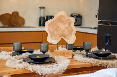 a wooden star on a table with black bowls at Balibay 1 - Private Villa with Pool in Canggu in Kerobokan