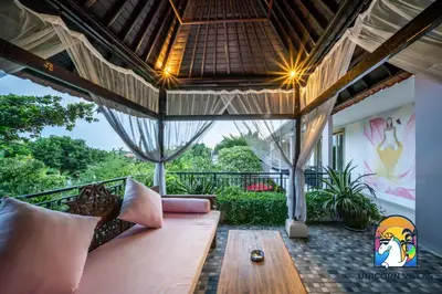 a living room with a couch and a table at Rumah Senang - by Unicorn Villas Bali in Seminyak
