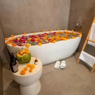 a bath tub filled with lots of candy in a bathroom at Balibay 2 - Best Place by the Beach in Canggu in Kerobokan