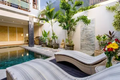 a villa with a swimming pool and a resort at Super 4 Bed, Sleeps 8, Just 300m walk from Beach in Legian