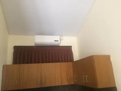 a room with a air conditioner on the ceiling at Simple apartment 1 Number 146 c in Seminyak